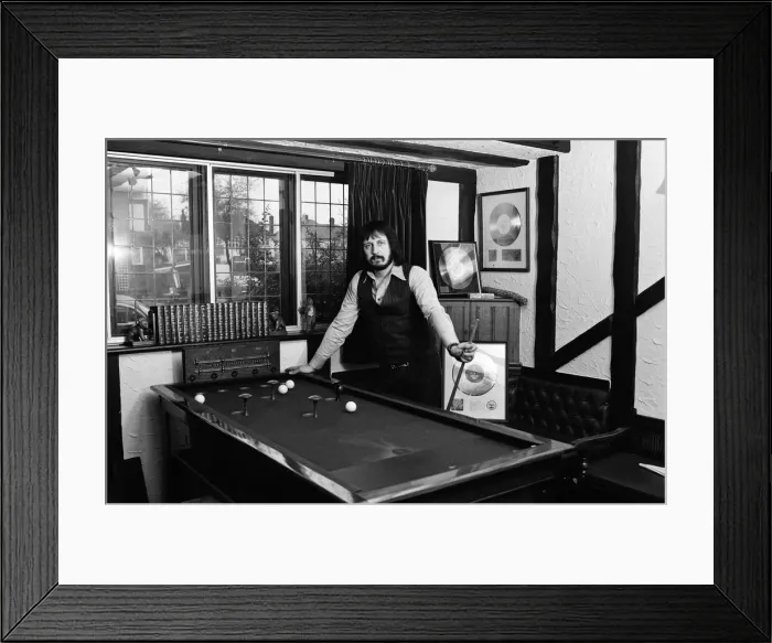 Framed Print : Bass guitarist of The Who rock group John Entwistle pictured at his home in Ealing