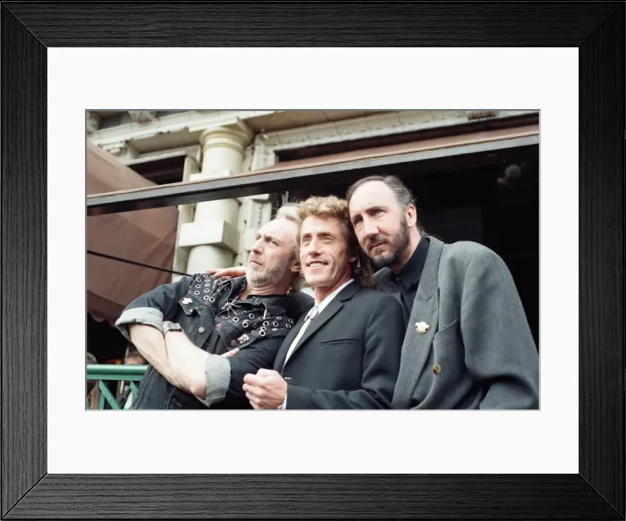 Framed Print : John Entwistle, Pete Townshend and singer Roger Daltrey of The Who rock group pat
