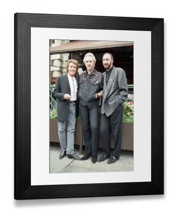 Framed Print : John Entwistle, Pete Townshend and singer Roger Daltrey of The Who rock group pat