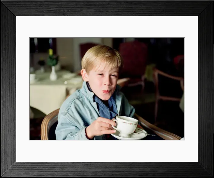 Framed Print : Macaulay Culkin sips his tea as he toasts his membership of he million-dollar-a movie