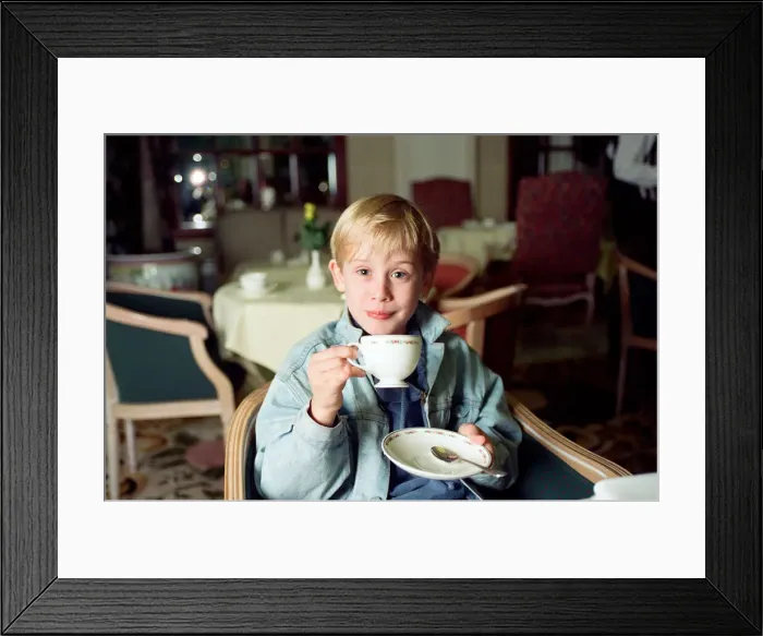 Framed Print : Macaulay Culkin sips his tea as he toasts his membership of he million-dollar-a movie Framed Print : Macaulay Culkin sips his tea as he toasts his membership of he million-dollar-a movie