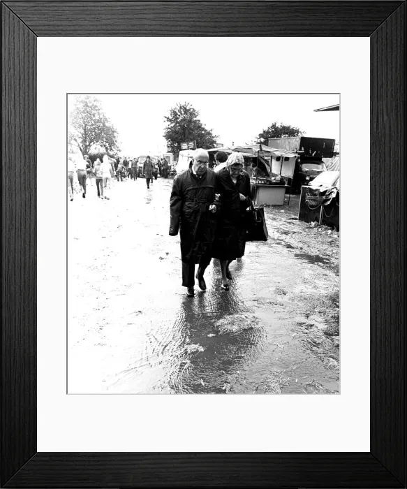 Framed Print : Severe stormy weather with torrential rain and flooding at the annual Summer Exhibition Framed Print : Severe stormy weather with torrential rain and flooding at the annual Summer Exhibition