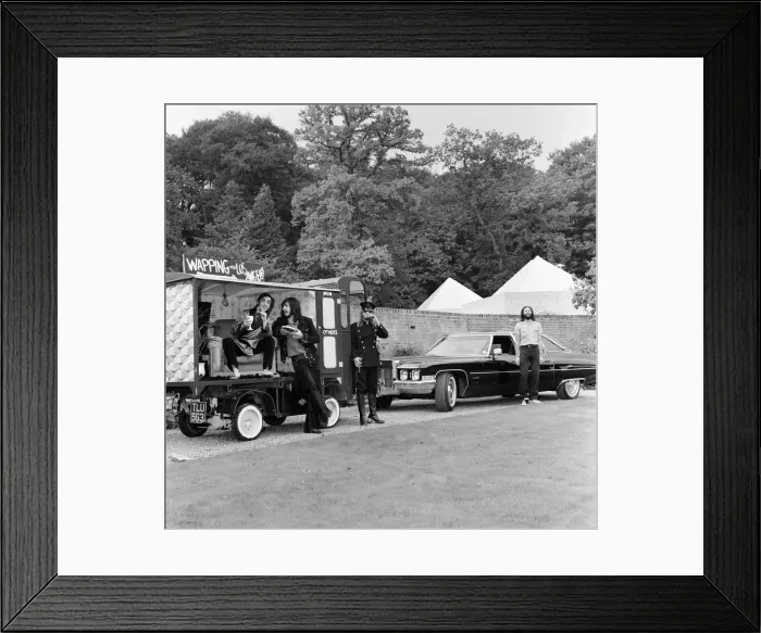 Framed Print : John Entwistle and Keith Moon of the rock group The Who show off their new cars