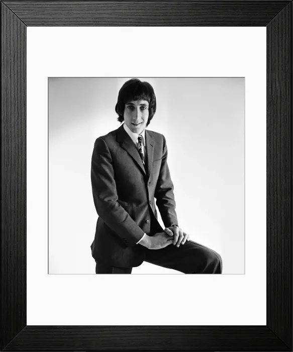 Framed Print : Pete Townshend of British rock group The Who, poses in the studio wearing suit and tie Framed Print : Pete Townshend of British rock group The Who, poses in the studio wearing suit and tie