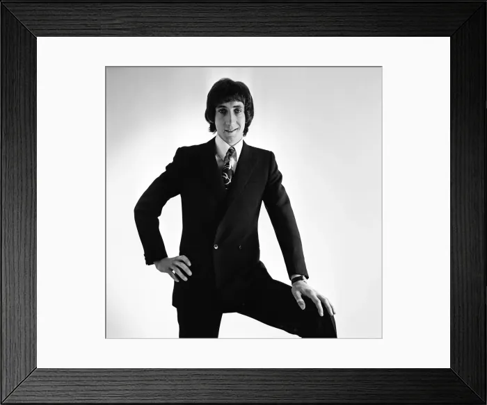 Framed Print : Pete Townshend of British rock group The Who, poses in the studio wearing suit and tie Framed Print : Pete Townshend of British rock group The Who, poses in the studio wearing suit and tie