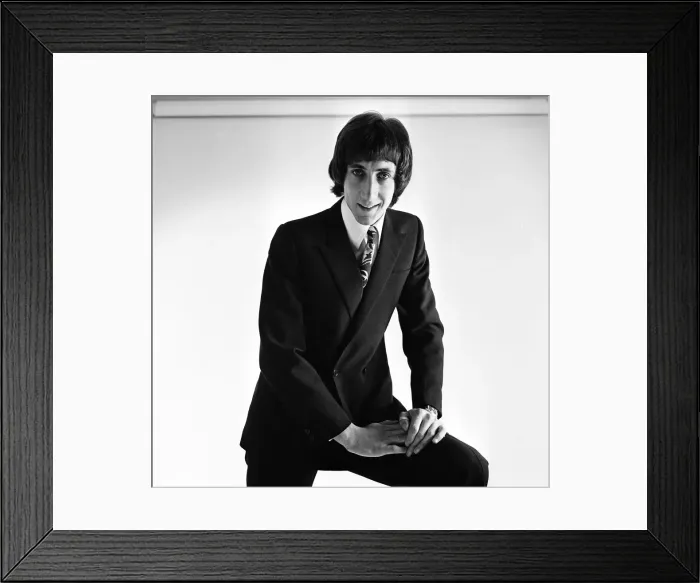 Framed Print : Pete Townshend of British rock group The Who, poses in the studio wearing suit and tie Framed Print : Pete Townshend of British rock group The Who, poses in the studio wearing suit and tie