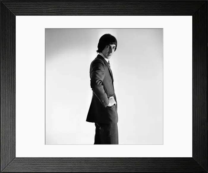 Framed Print : Pete Townshend of British rock group The Who, poses in the studio wearing suit and tie Framed Print : Pete Townshend of British rock group The Who, poses in the studio wearing suit and tie