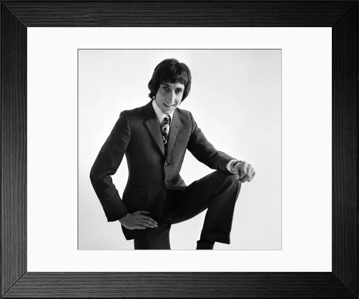 Framed Print : Pete Townshend of British rock group The Who, poses in the studio wearing suit and tie Framed Print : Pete Townshend of British rock group The Who, poses in the studio wearing suit and tie