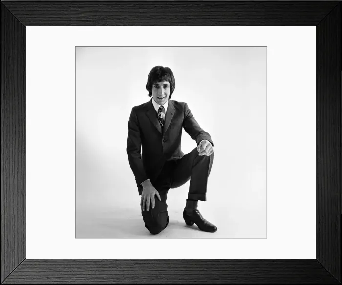 Framed Print : Pete Townshend of British rock group The Who, poses in the studio wearing suit and tie Framed Print : Pete Townshend of British rock group The Who, poses in the studio wearing suit and tie