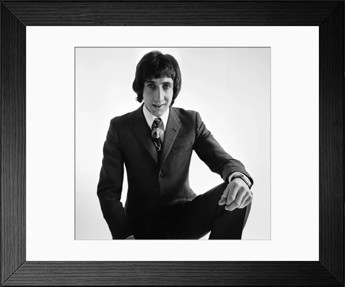 Framed Print : Pete Townshend of British rock group The Who, poses in the studio wearing suit and tie Framed Print : Pete Townshend of British rock group The Who, poses in the studio wearing suit and tie