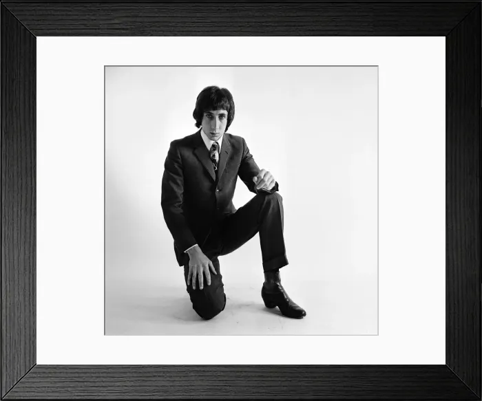 Framed Print : Pete Townshend of British rock group The Who, poses in the studio wearing suit and tie Framed Print : Pete Townshend of British rock group The Who, poses in the studio wearing suit and tie