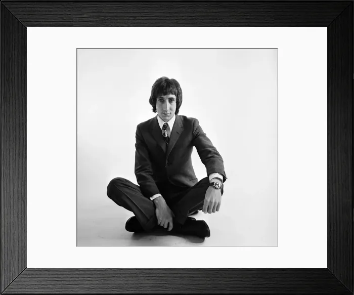 Framed Print : Pete Townshend of British rock group The Who, poses in the studio wearing suit and tie Framed Print : Pete Townshend of British rock group The Who, poses in the studio wearing suit and tie
