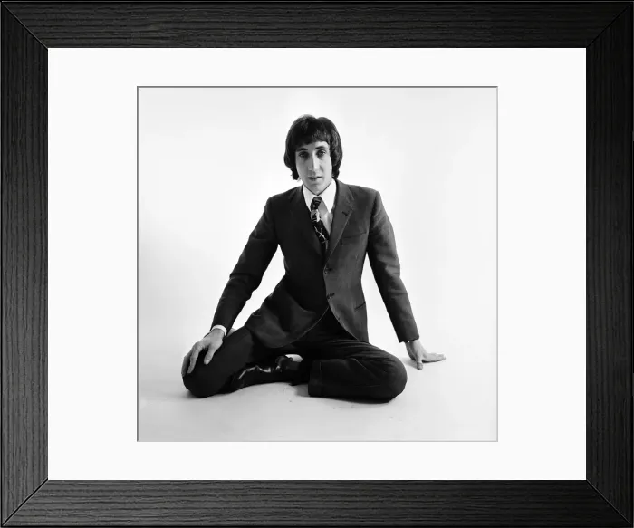 Framed Print : Pete Townshend of British rock group The Who, poses in the studio wearing suit and tie Framed Print : Pete Townshend of British rock group The Who, poses in the studio wearing suit and tie