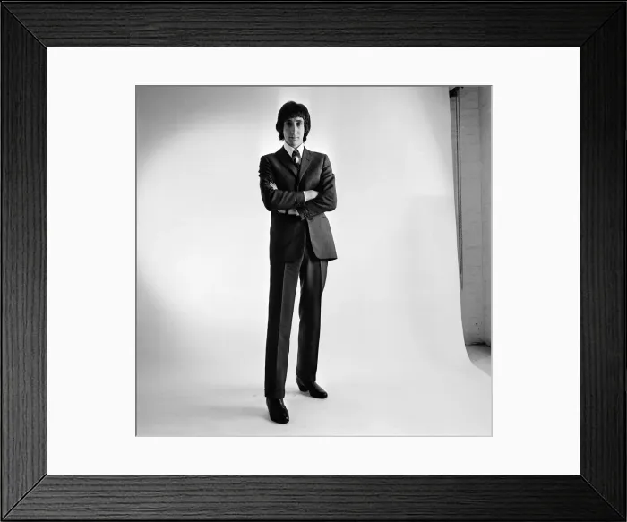 Framed Print : Pete Townshend of British rock group The Who, poses in the studio wearing suit and tie Framed Print : Pete Townshend of British rock group The Who, poses in the studio wearing suit and tie
