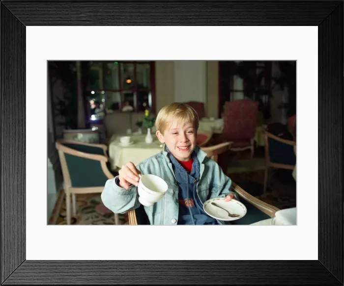 Framed Print : Macaulay Culkin sips his tea as he toasts his membership of he million-dollar-a movie Framed Print : Macaulay Culkin sips his tea as he toasts his membership of he million-dollar-a movie