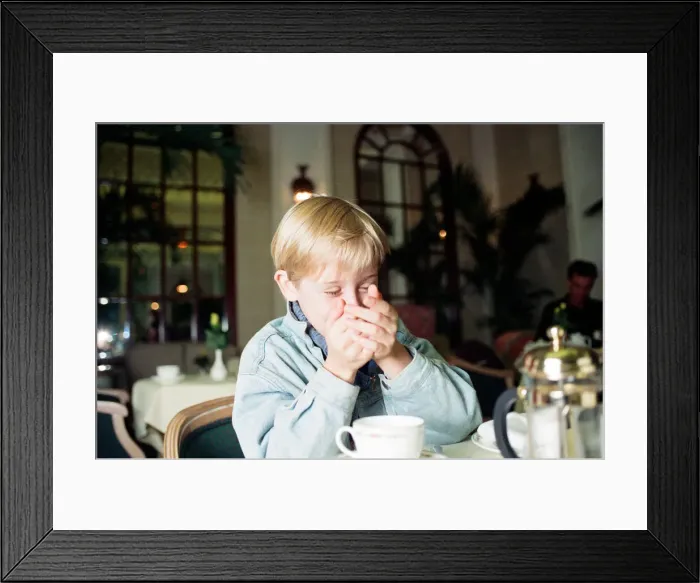 Framed Print : Macaulay Culkin sips his tea as he toasts his membership of he million-dollar-a movie