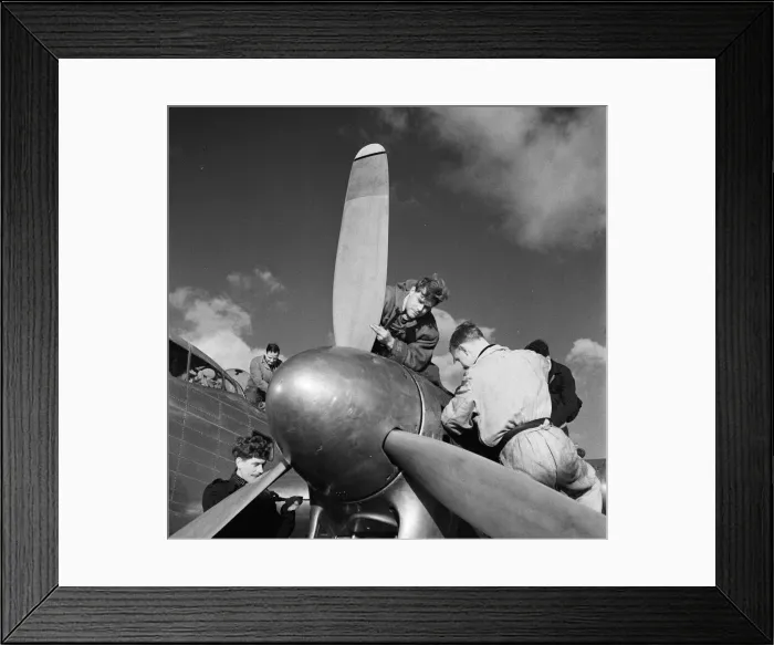 Framed Print : Flight engineers work on the Rolls Royce Merlin engines of a BOAC Lancastrian at Hurn Framed Print : Flight engineers work on the Rolls Royce Merlin engines of a BOAC Lancastrian at Hurn