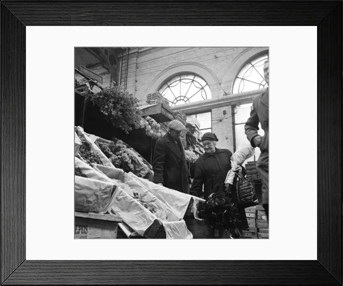 Framed Print : The Ladies of Covent Garden, Covent Garden, London. A lady shops for flowers Framed Print : The Ladies of Covent Garden, Covent Garden, London. A lady shops for flowers