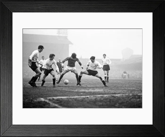 Framed Print : Manchester United footballer George Best in action to beat three defenders during the FA Framed Print : Manchester United footballer George Best in action to beat three defenders during the FA