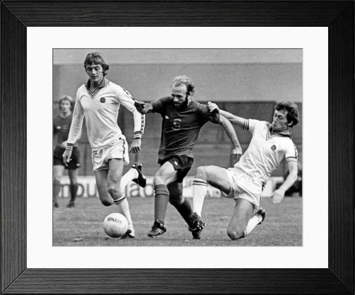 Framed Print : Leeds United v Derby County. Archie Gemmill, is brought down as he races through Framed Print : Leeds United v Derby County. Archie Gemmill, is brought down as he races through