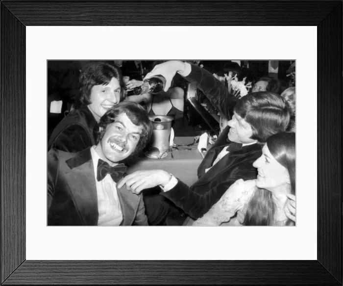 Framed Print : Derby County footballer Roger Davies looks on as David Nish pours champagne over Peter Framed Print : Derby County footballer Roger Davies looks on as David Nish pours champagne over Peter