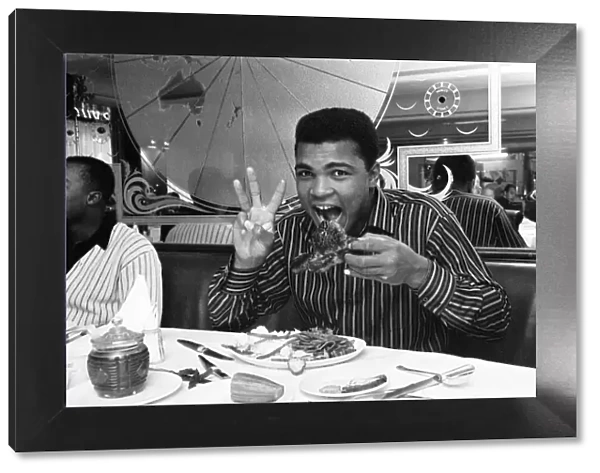 Cassius Clay (Muhammad Ali) eating stake at Isows restaurant in Soho Brewer Street London