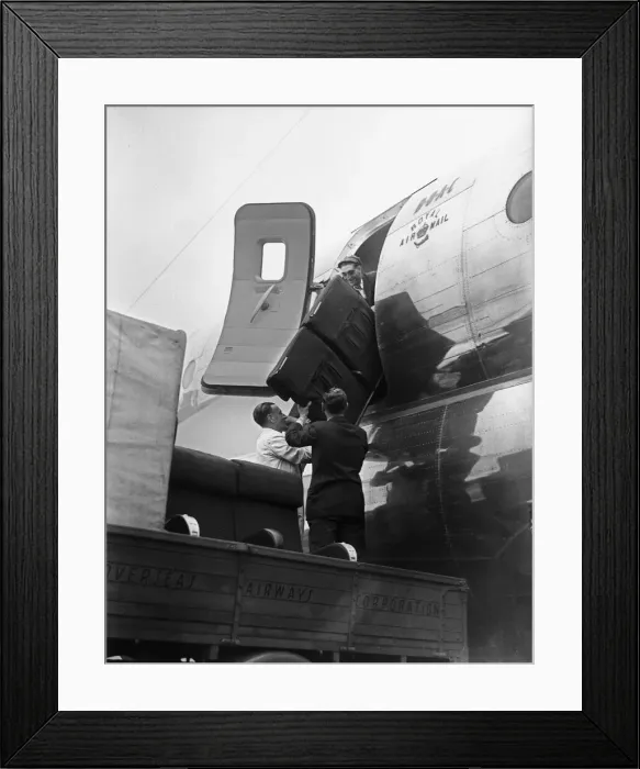 Framed Print : BOCA Boeing Strato Cruiser being adapted and loaded with supplies for flood victims in
