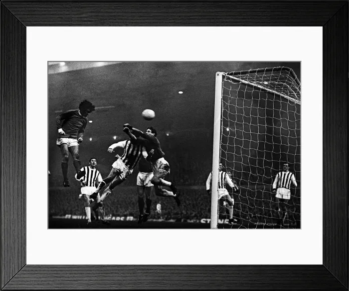 Framed Print : Manchester United footballer George Best in action to score his second goal with a header