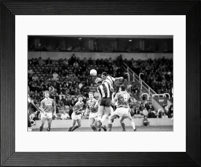 Framed Print : Don Goodman of West Bromwich Albion rises above everyone to flick on a header during Framed Print : Don Goodman of West Bromwich Albion rises above everyone to flick on a header during