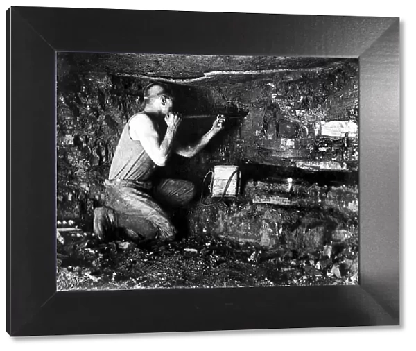A miner working the coal face circa 1930s