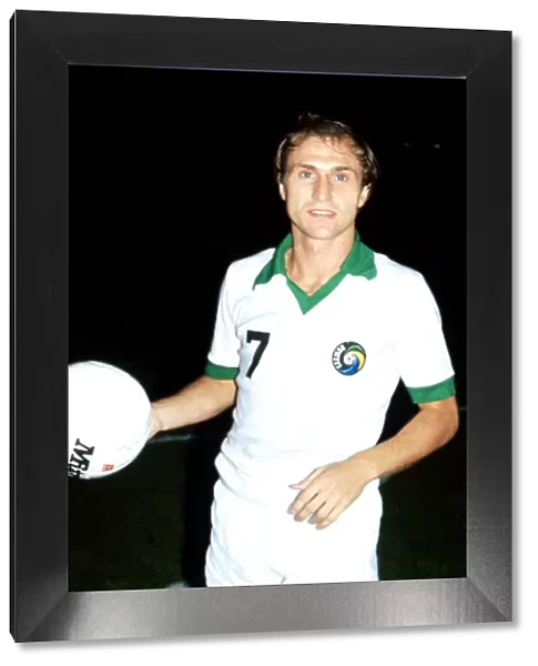 New York Cosmos Dennis Tueart holding a football October 1978