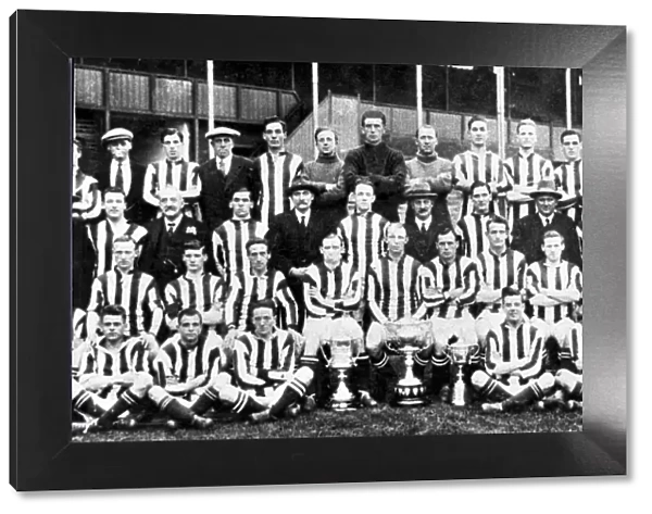 West Bromwich Albion team group pose with their trophies before the start of