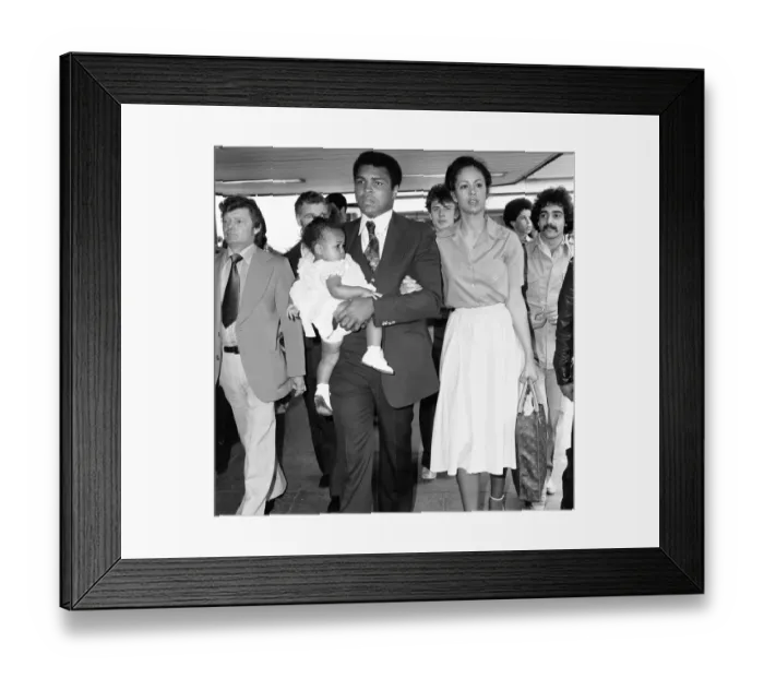Framed Print : Muhammad Ali with second wife Veronica and their baby girl Hana arriving in England