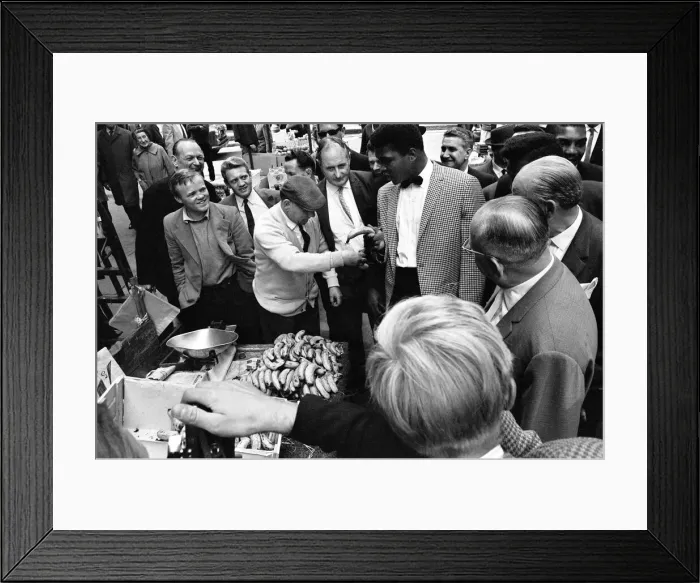 Framed Print : Cassius Clay aka (Muhammad Ali) walks around a market in Soho on the day of his arrival Framed Print : Cassius Clay aka (Muhammad Ali) walks around a market in Soho on the day of his arrival