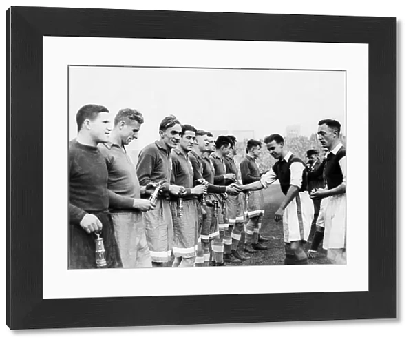 Cardiff City players present the Dynamo Moscow players with miner