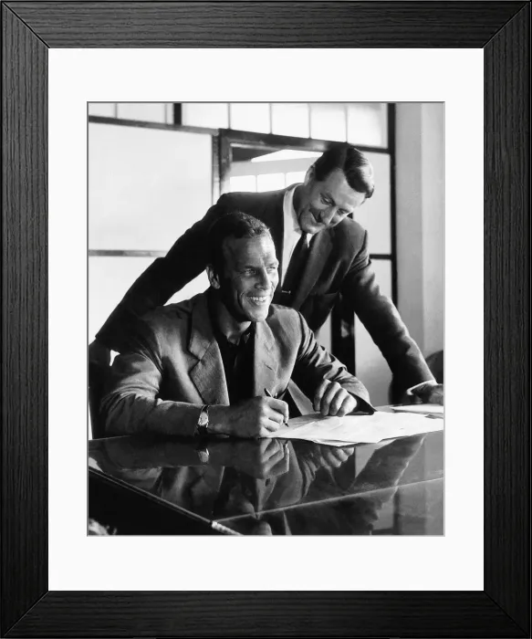 Framed Print : John Charles signs for Cardiff watched by manager George Swindon following his transfer