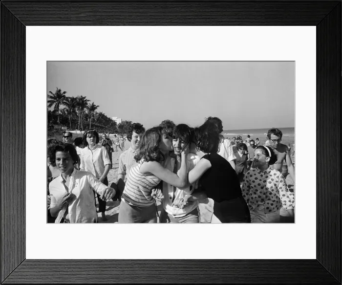 Framed Print : Ringo Starr is besieged by schoolgirls as he strolls on a beach in Miami, Florida