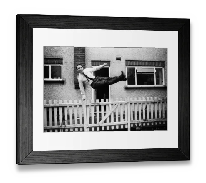 Framed Print : Tottenham Hostpurs footballer Jimmy Greaves leaps over a garden fence, January 1964 Framed Print : Tottenham Hostpurs footballer Jimmy Greaves leaps over a garden fence, January 1964