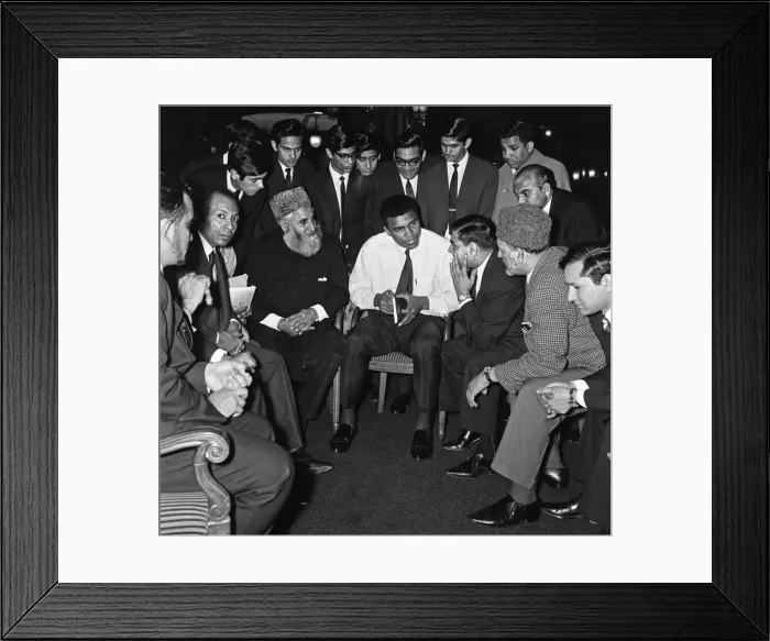 Framed Print : Muhammad Ali (Cassius Clay) speaking to Muslims holding a book called Towards Framed Print : Muhammad Ali (Cassius Clay) speaking to Muslims holding a book called Towards