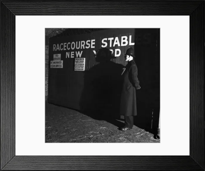 Framed Print : 1952 Grand National. A policeman on guard outside new yard stables at Aintree Framed Print : 1952 Grand National. A policeman on guard outside new yard stables at Aintree