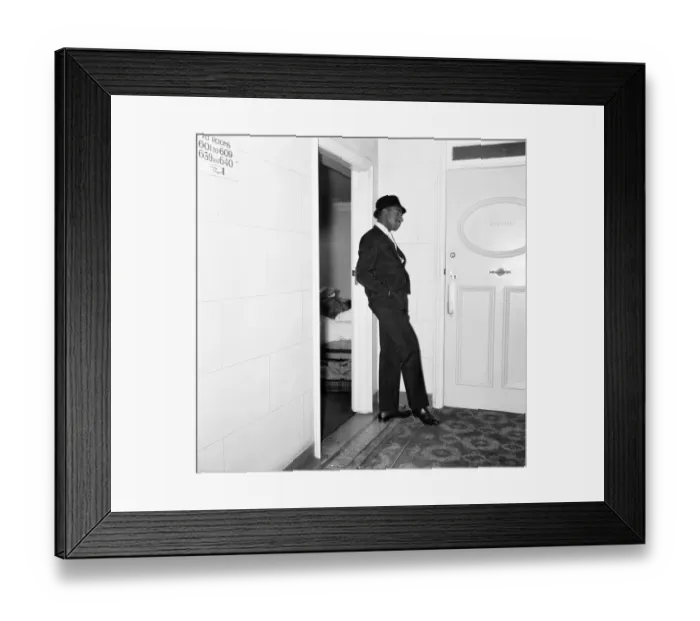 Framed Print : Cassius Clays bodyguard Ronald King keeps watch outside the Piccadilly Hotel room Framed Print : Cassius Clays bodyguard Ronald King keeps watch outside the Piccadilly Hotel room