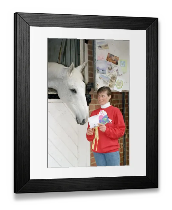 Framed Print : Racing Legend Desert Orchid being read his fan mail by stable girl Janice Coyle