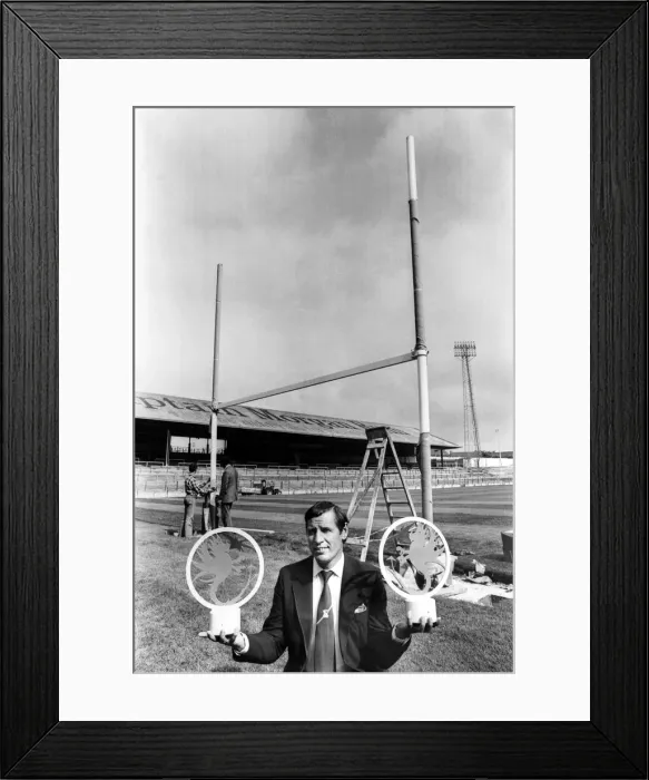 Framed Print : Cardiff City general manager, Ron Jones, holds the Blue Dragons post caps at Ninian Park Framed Print : Cardiff City general manager, Ron Jones, holds the Blue Dragons post caps at Ninian Park