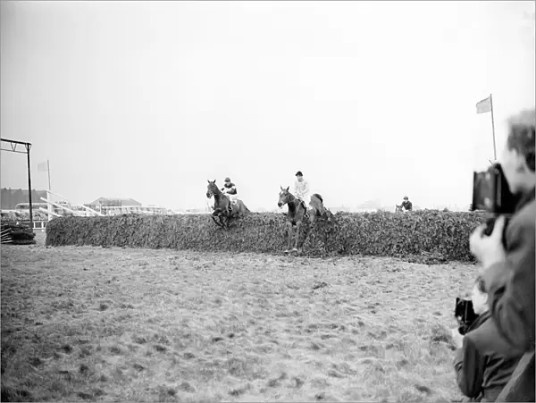 Grand National race at Aintree Racecourse. Dick Francis on Devon Loch (right