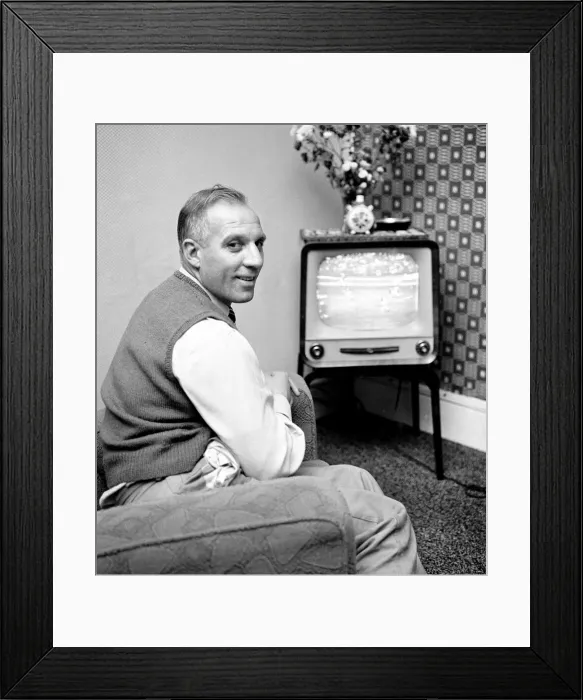 Framed Print : Tottenham Hostpur footballer Eddie Bailey at home watching a match on the television Framed Print : Tottenham Hostpur footballer Eddie Bailey at home watching a match on the television