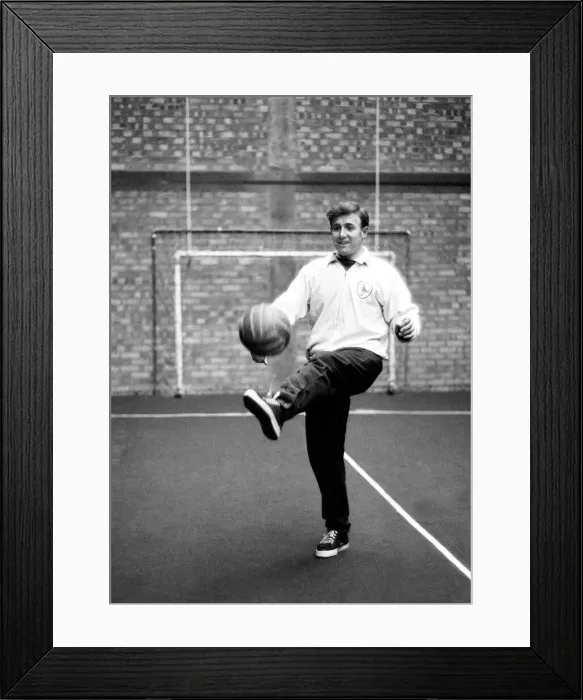 Framed Print : Tottenham Hotspur winger Terry Medwin practices his ball skills as he trains alone Framed Print : Tottenham Hotspur winger Terry Medwin practices his ball skills as he trains alone