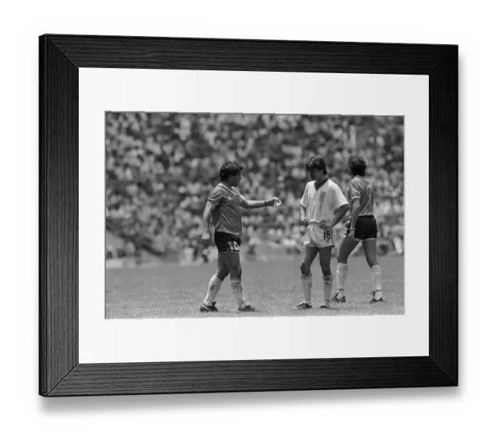 Framed Print : Diego Maradona (left) seen with Steve Hodge during the England v Argentina Hand of God Framed Print : Diego Maradona (left) seen with Steve Hodge during the England v Argentina Hand of God