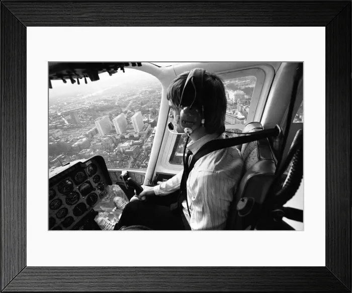 Framed Print : Mike Oldfield, musician and composer, pilots helicopter from Blackfriars