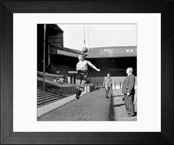 Framed Print : Blackpool Football Club. Stan Mortensen heading the ball during training