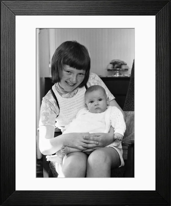Framed Print : Kathryn Wood of Farsley, Pudsey, Leeds poses for the camera with her eight week old niece